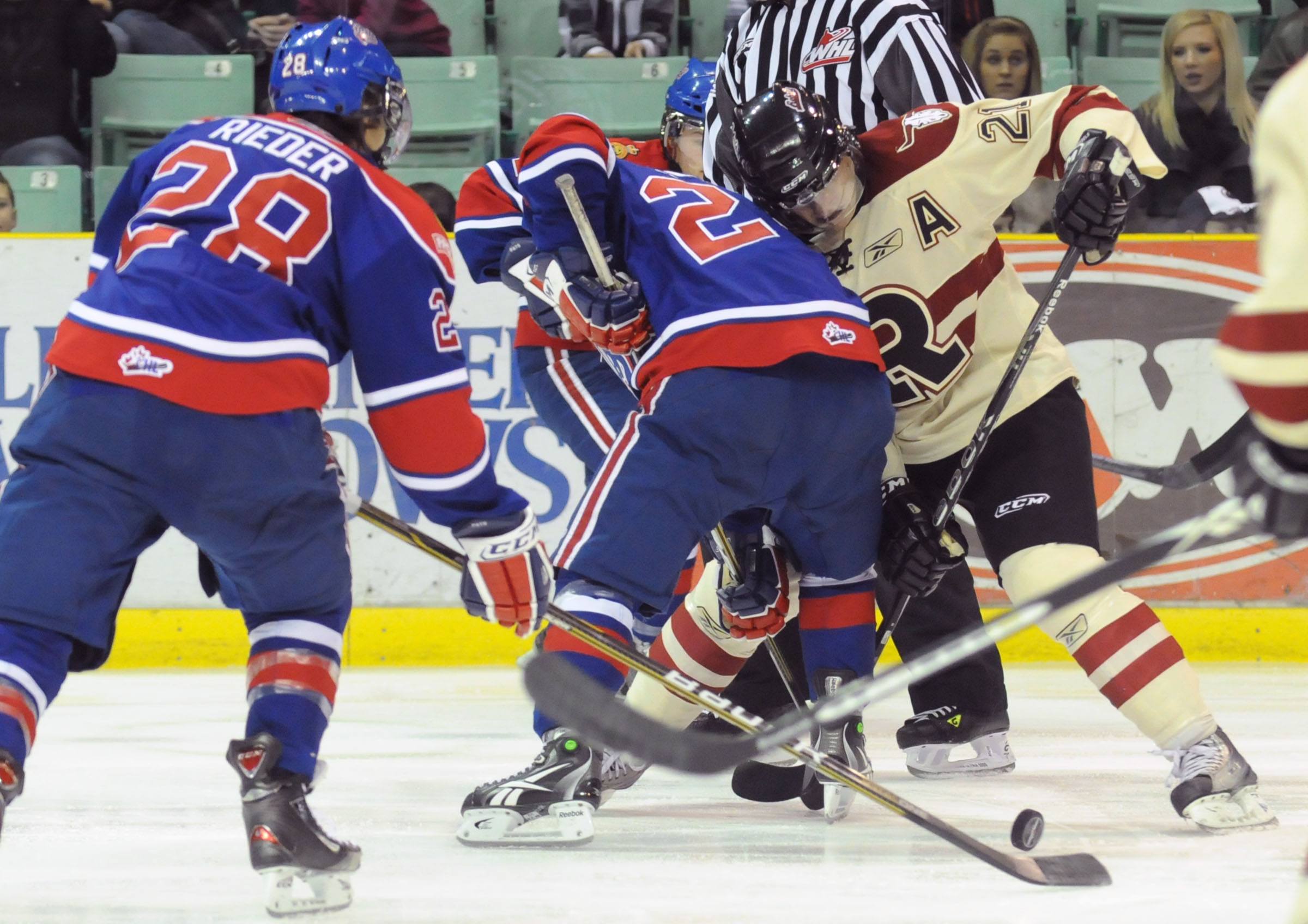 SCRAMBLE- Red Deer Rebel Byron Froese fights for the puck during Friday nights WHL action against the Regina Pats. The Rebels lost 2-1.