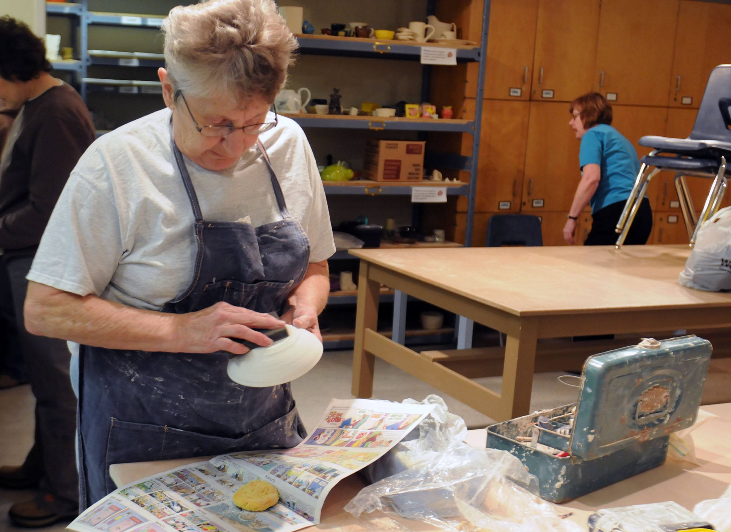 SANDING- Jean Nichols sands one of her clay bowls she created at the Recreation Centre in Red Deer during a pottery meeting. Artists meet in the basement of the Recreation Centre to work on their skills and perfect their pottery.