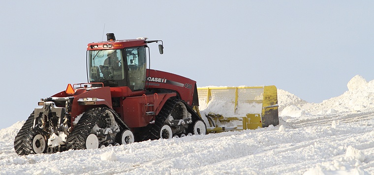 The City of Red Deer has employed the services of farmers in the campaign to move snow in the city. The snow dumps in the Edgar Industrial area and at the City of Red Deer landfill are growing by the day and heavy machinery is needed to plow the snow to the tops of the pile.