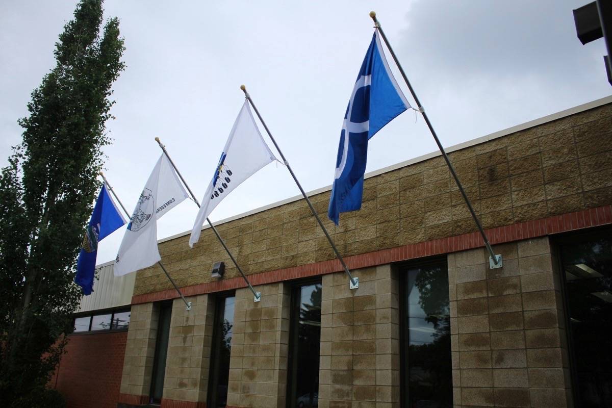 NEW BEGINNING - Treaty and Metis flags were raised at the Red Deer Public School District office on Wednesday. Emily Rogers/Red Deer Express
