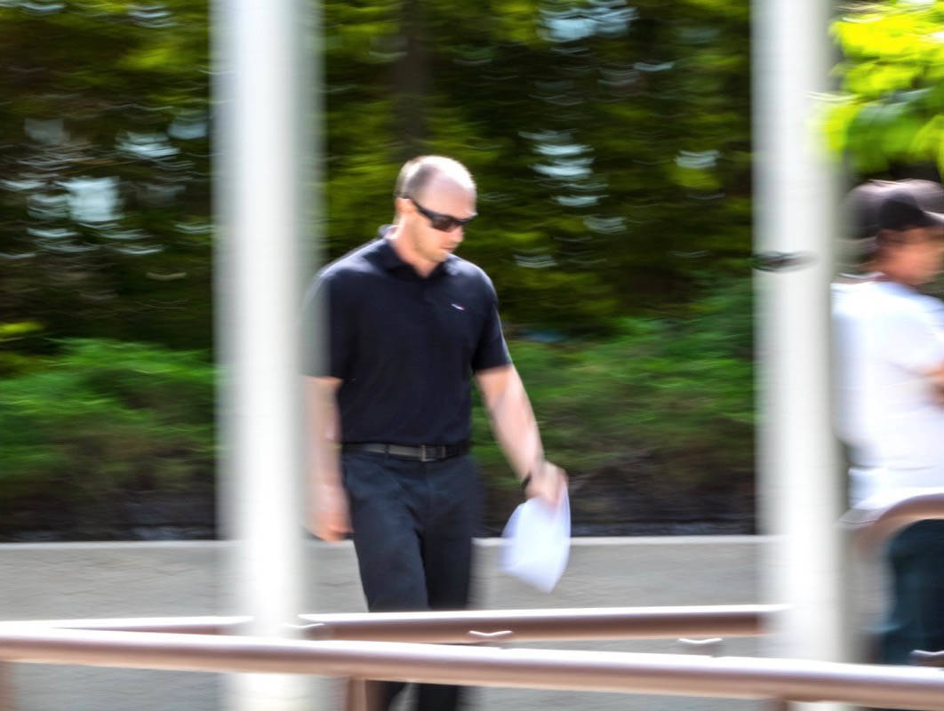 IN COURT - Const. Jason Tress, charged with sexual assault, is seen leaving Red Deer Provincial Court on Monday. Todd Colin Vaughan/Red Deer Express