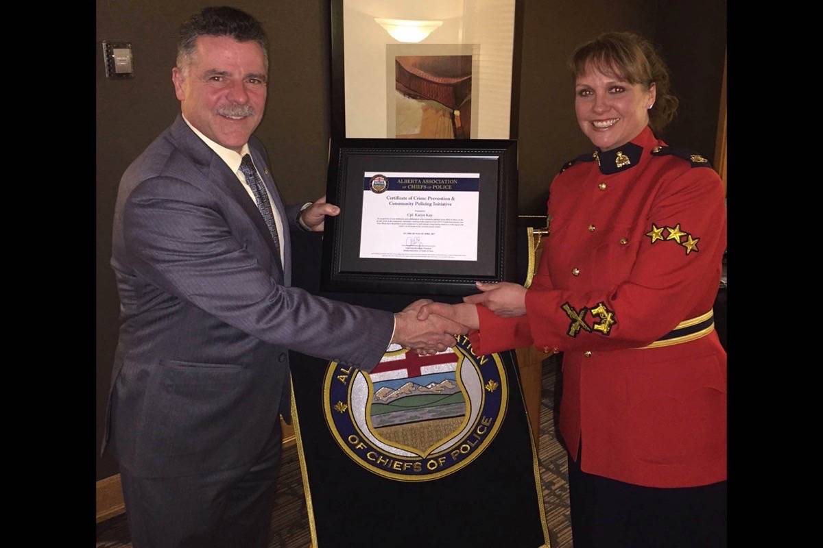 HONOUR - From left, Supt. Ken Foster and Cpl. Karyn Kay stand together after Kay received recognition for outstanding service.                                photo submitted