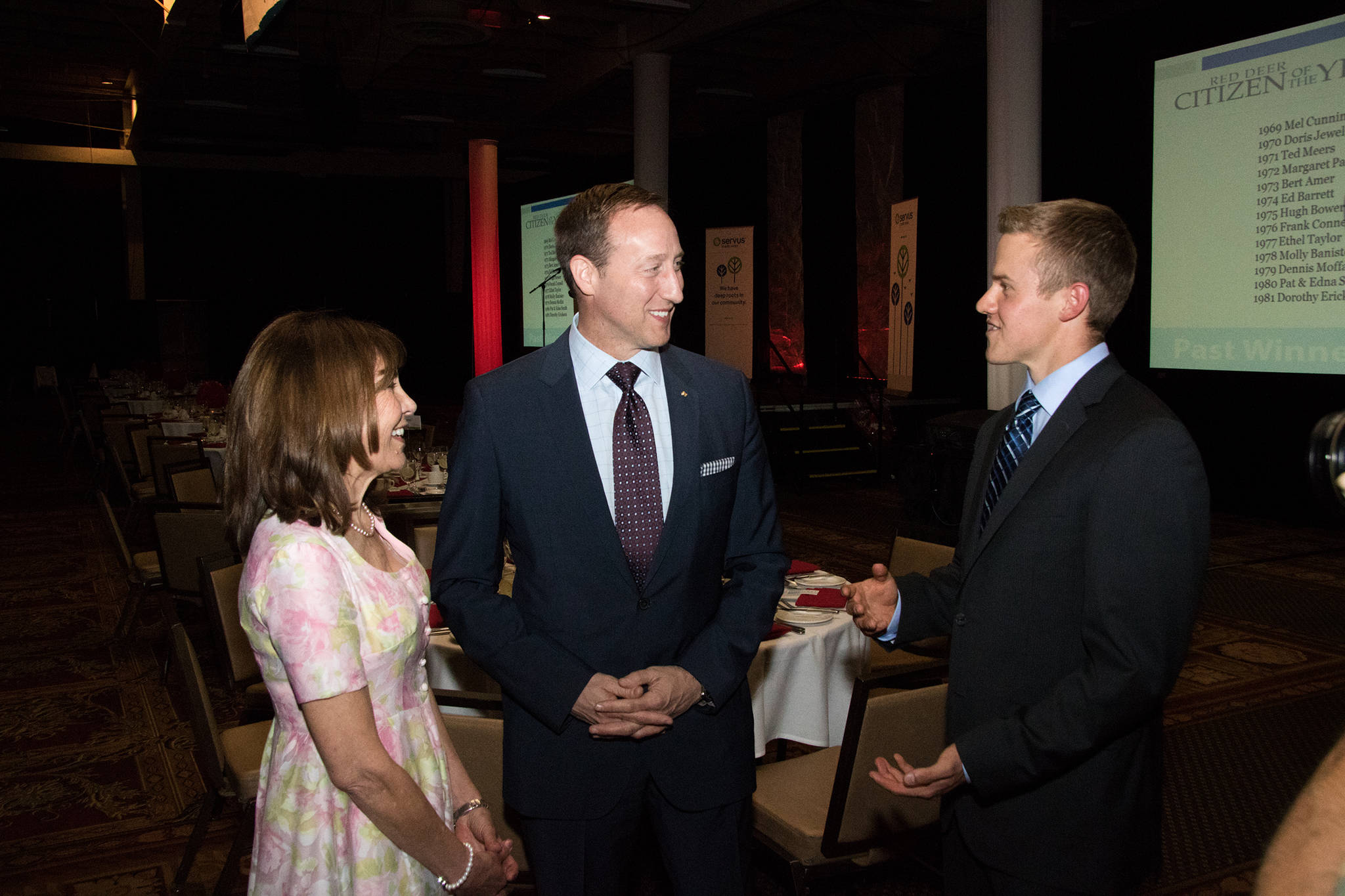 HONOUR - From left, Gloria Beck, Citizen of the Year, Peter MacKay, former minister of defence and Adam Guthrie, Young Citizen of the Year, chat before the annual Red Deer Rotary Club Citizen of the Year award gala.                                Todd Colin Vaughan/Red Deer Express