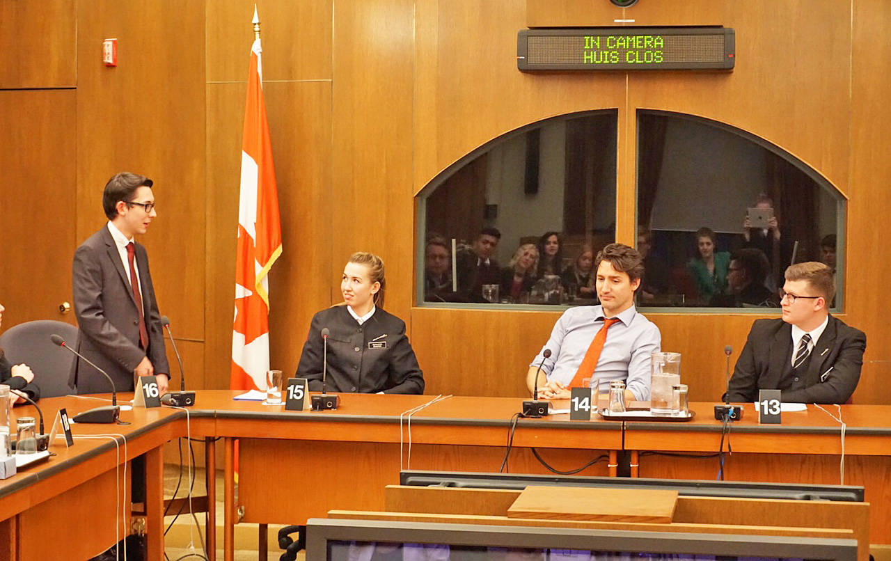 IMPORTANT TASKS - Red Deerian Alexander Wozny speaks to Prime Minister Justin Trudeau in his work on Ottawa’s Parliament Hill.                                photo submitted