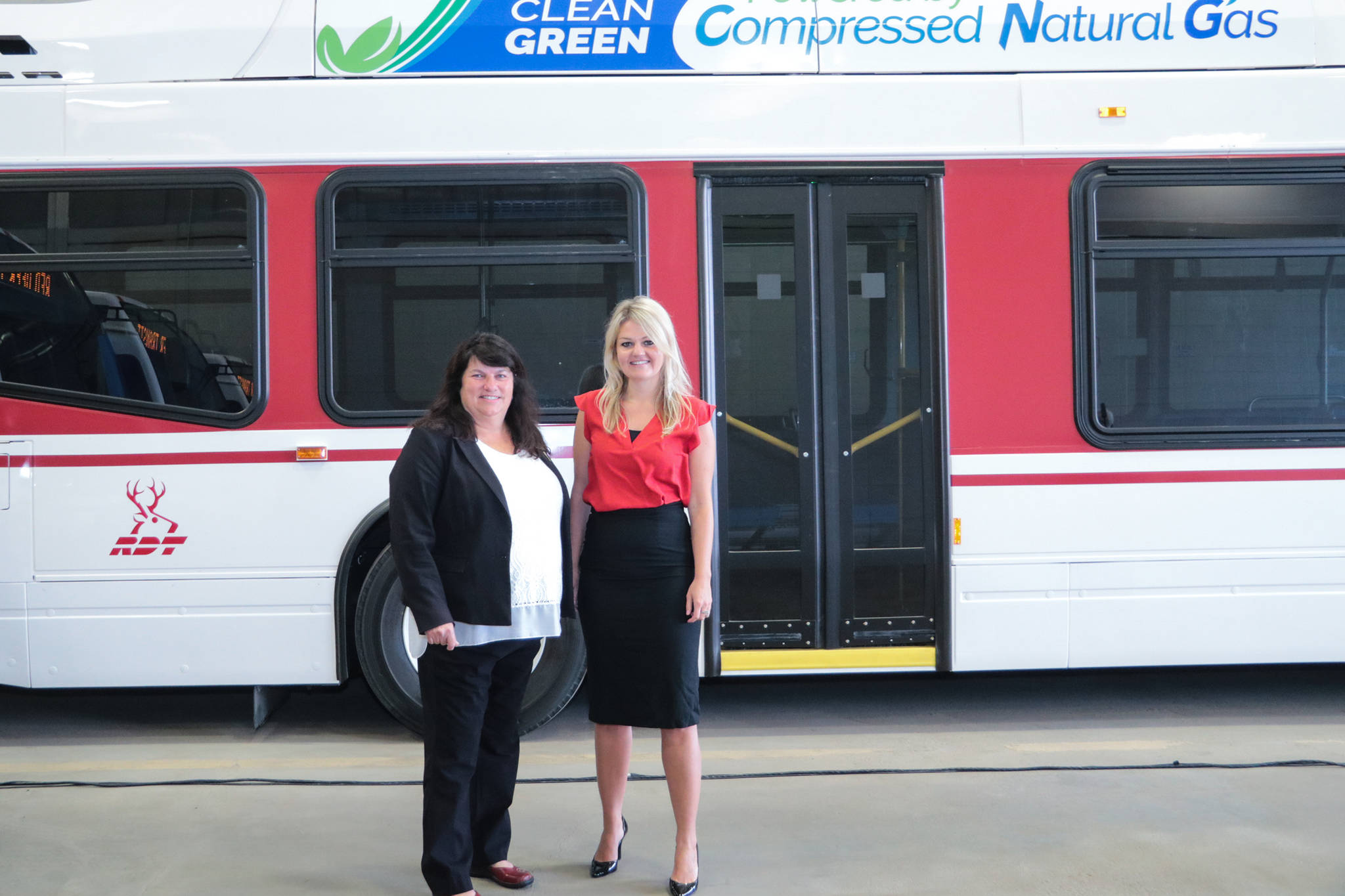 GREEN BUSSES - Mayor Tara Veer and Red Deer North MLA Kim Schreiner were on hand for for the unveiling the new Red Deer Transit compressed natural gas (CNG) bus fleet.                                Todd Colin Vaughan/Red Deer Express
