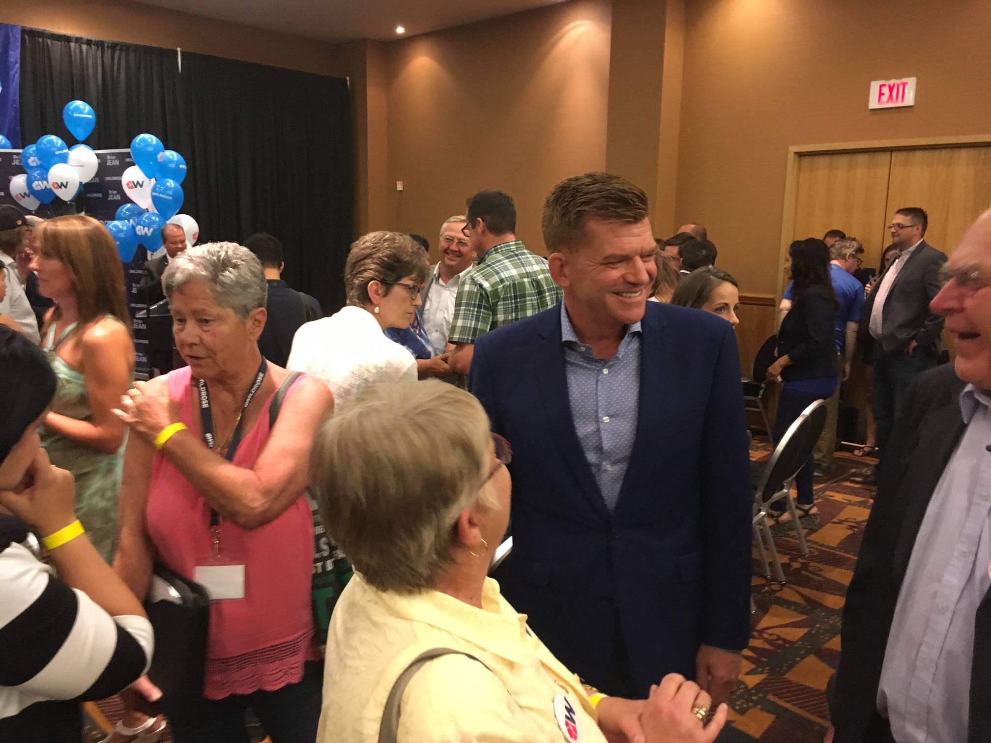 MOVING AHEAD - Wildrose Party Leader Brian Jean chats with supporters at the Radisson Hotel in Red Deer on Saturday afternoon after learning that his party supported joining forces with the Progressive Conservatives by a margin of 95%.                                Mark Weber/Red Deer Express