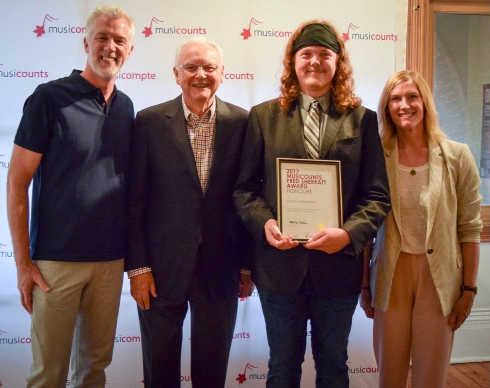 HONOUR - Colin Langstraat stands with his Fred Sherratt Award through MusiCount. He was one of 11 Canadians to receive the award last month.                                photo submitted