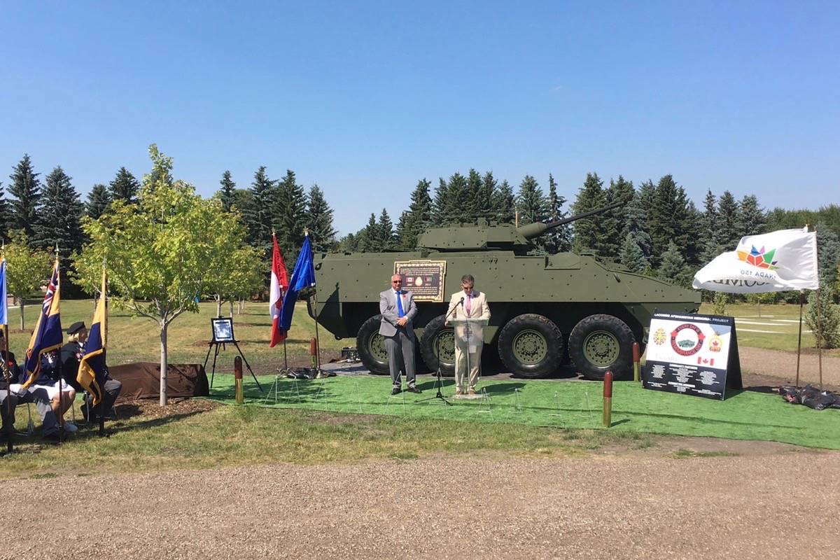 HONOUR - Many gathered this past Saturday afternoon for the official unveiling and dedication of the Lacombe Afghanistan Memorial in the Lacombe Cemetery’s Field of Honour. A CF-18 Hornet fly-by took place during the ceremony as well. Mark Weber/Red Deer Express