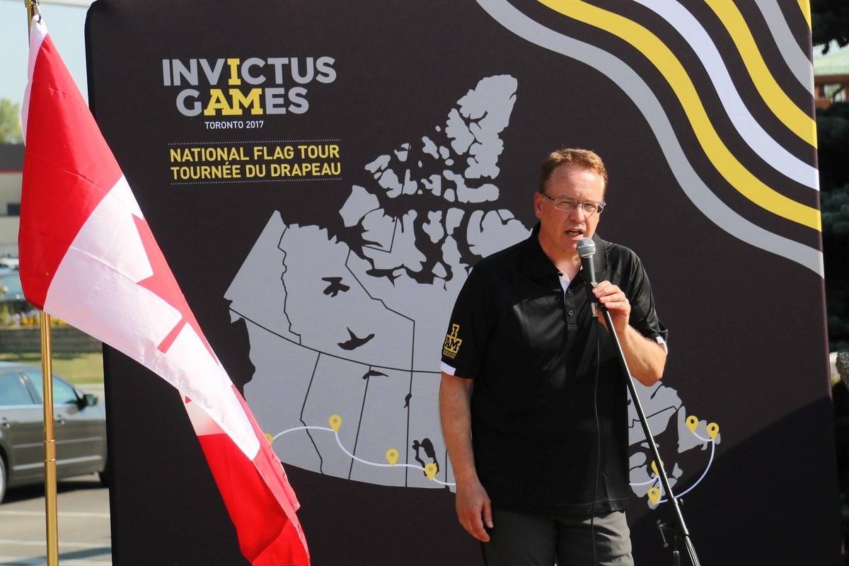 COMMUNITY SPIRIT - Steve Wallace, chief marketing officer for the Invictus Games, and the Invictus Games flag tour, which is paralympic style games for wounded warriors, made a stop on the Red Deer Legion #35 on Wednesday. Todd Colin Vaughan/Red Deer Express