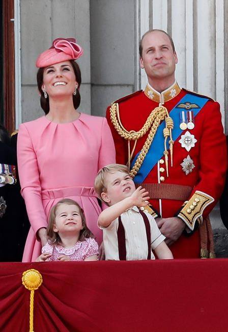 The Duke and Duchess of Cambridge, and their children Princess Charlotte and Prince George, appear on the balcony of Buckingham Palace, after attending the annual Trooping the Colour Ceremony in London on June 17, 2017. AP Photo/Kirsty Wigglesworth.