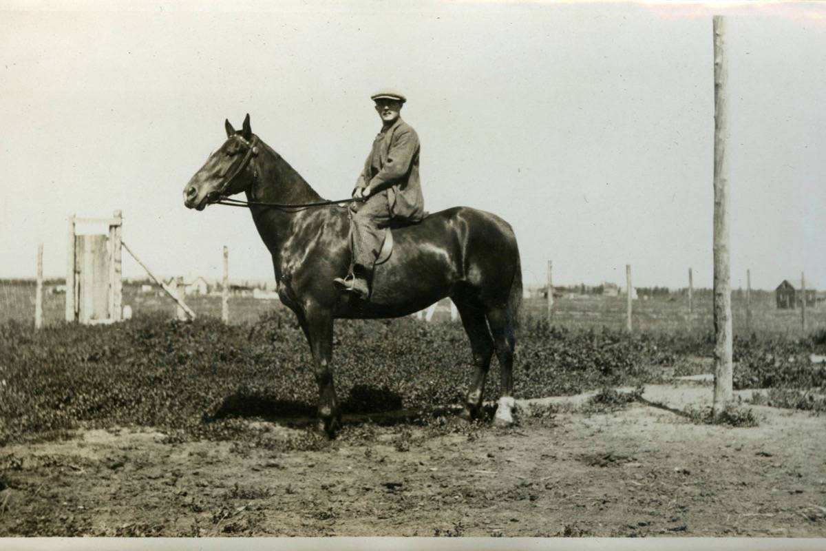 PIONEER - Laurence Banting on his horse Diamond on his new farm south of West Park in Red Deer, 1923. The houses and acreages in the old (north) part of West Park can be seen in distance. Red Deer Archives P6145