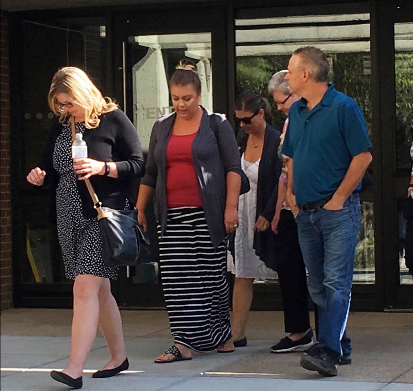 GUILTY PLEA - Shelly Kolodychuk, centre in white dress and sunglasses, leaves Red Deer Provincial Court on Wednesday after pleading guilty to operating a motor vehicle over 80mg. The incident happened when she was driving a school bus in Red Deer this past June. Erin Fawcett/Red Deer Express