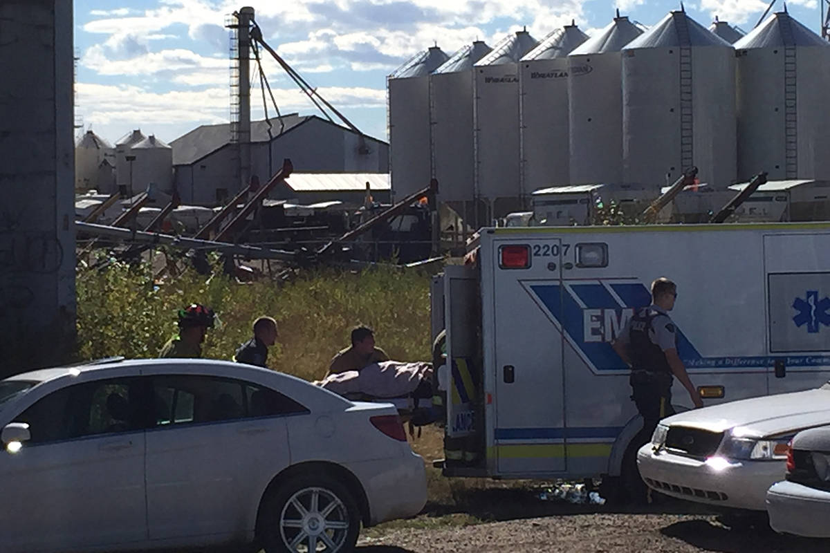 EMS crews and members of the Ponoka Fire Department load up a patient was found Sept. 10 with severe injuries in Ponoka. STARS Air Ambulance was called to Ponoka shortly after. Photo by Jeffrey Heyden-Kaye