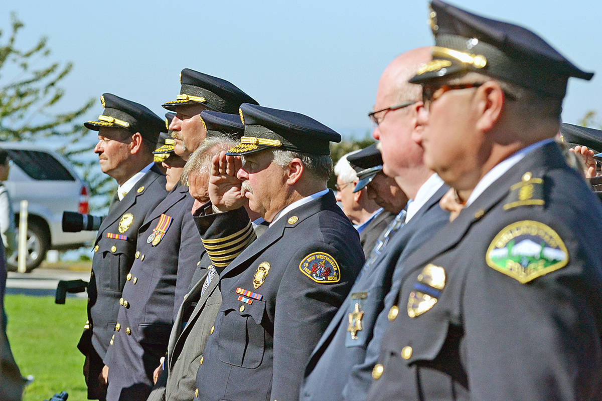 New Westminster fire Chief Tim Armstrong salutes during the 9-11 memorial service this morning at Peace Arch Park. (Tracy Holmes photo)