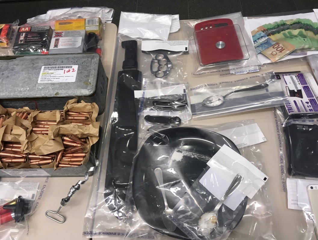 SEIZURE - The Priority Crimes Task Force seizes guns and drugs in six Sylvan Lake search warrants. Erin Fawcett/Red Deer Express