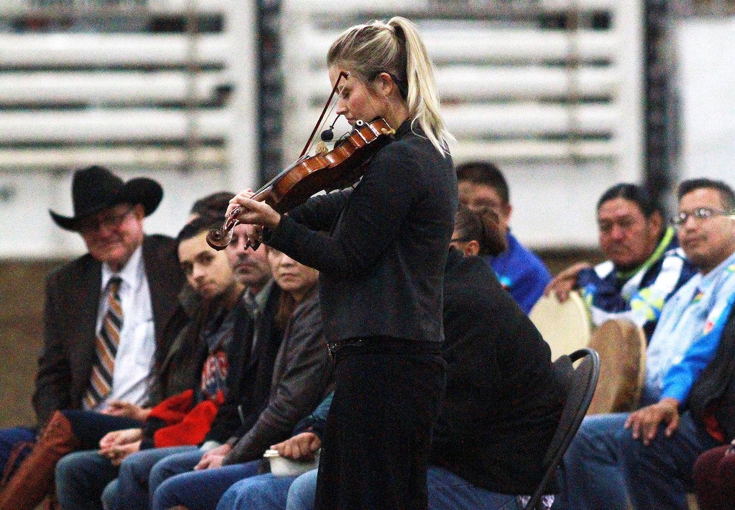Former 2013 Miss Rodeo Canada Gillian Grant plays the violin in honour of rodeo legend Winston Bruce.