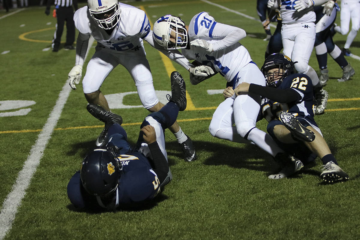 EARLY SEASON - Lightning player Austin Schneider pushed through the ‘Lightning Strikes’ - Notre Dame defense. The Lightning cruised to an easy 32-6 victory. Todd Colin Vaughan/Red Deer Express