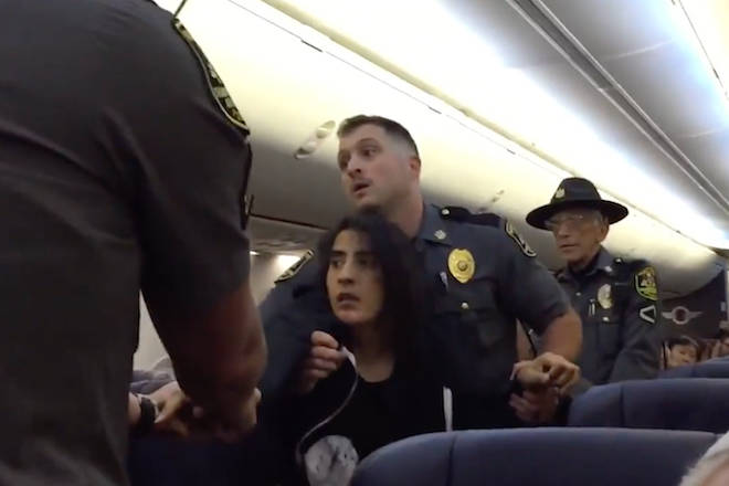 Police drag woman off Southwest Airlines flight