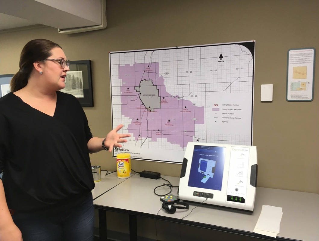 NEW TECHNOLOGY - Samantha Rodwell, deputy returning officer for the City of Red Deer, demonstrates new technology that will be used during the advance vote in Red Deer. Erin Fawcett/Red Deer Express