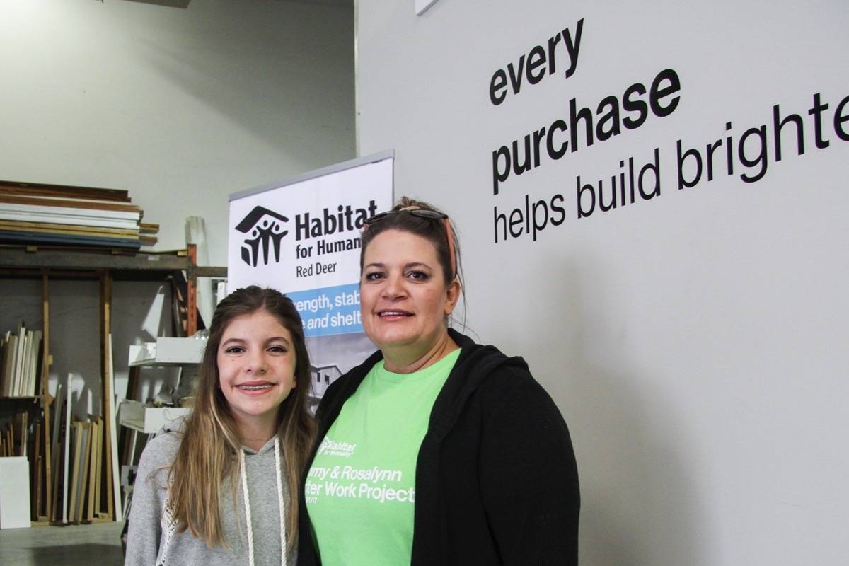 OPPORTUNITY - Jancee and Keely Hawthorne moved into their new Habitat for Humanity home in Lacombe in July. Habitat recently announced their new build project in Red Deer in the Aspen Heights neighbourhood. Todd Colin Vaughan/Red Deer Express
