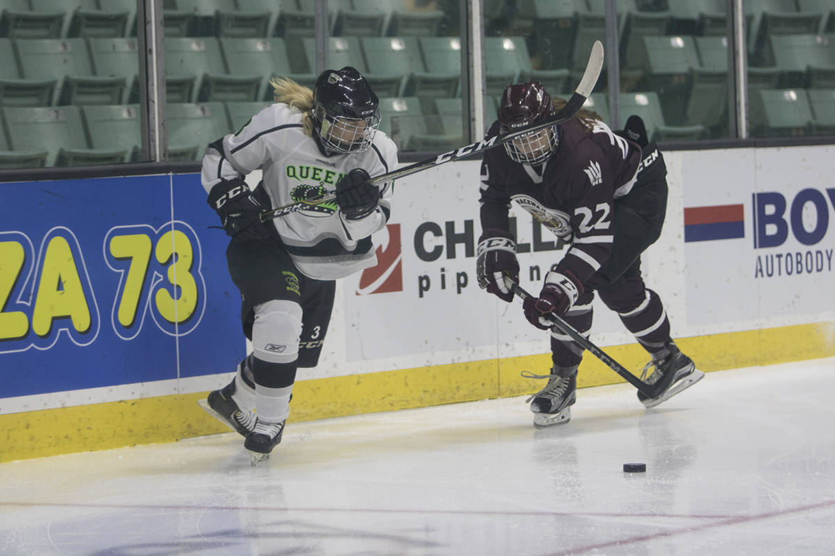 QUEENS HOCKEY - Red Deer College Queen Jade Petrie tried to wheel around the Griffins defender. Todd Colin Vaughan/Red Deer Express