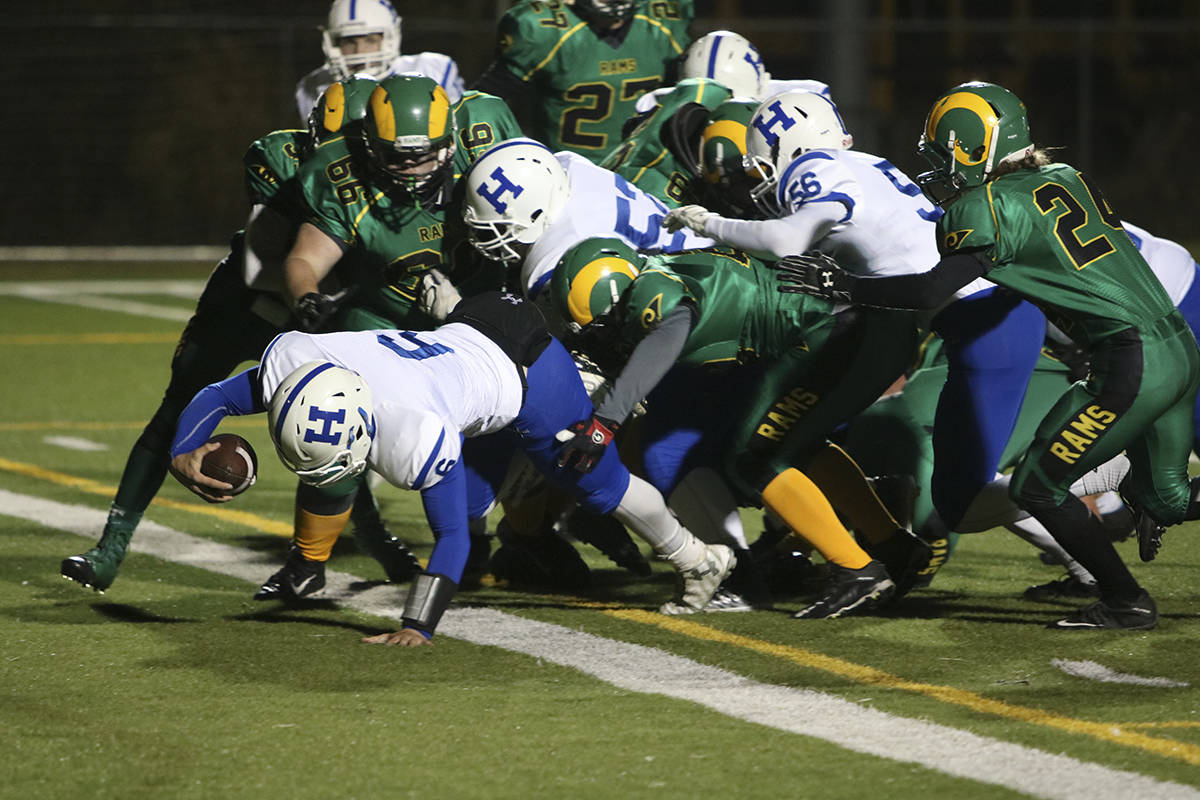 FIRST SEED - Lightning QB Brandon Rees snuck in this TD through multiple Lacombe Ram defenders.                                Todd Colin Vaughan/Red Deer Express