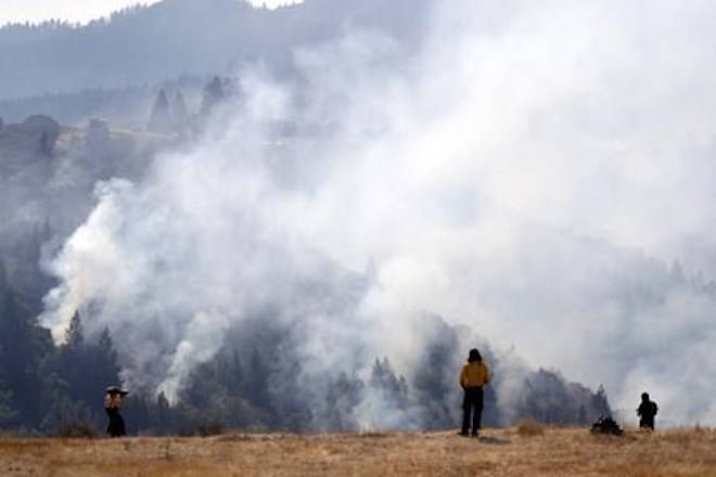 California fire victims return home