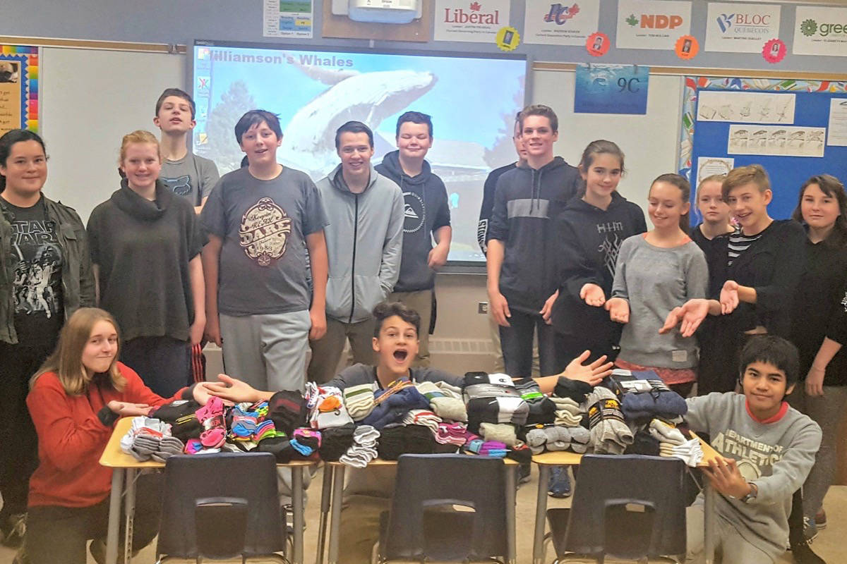 GENEROSITY - The Grade 9C class at École Lacombe Junior High School collected more than 300 pairs of new socks and more than 50 pairs of gently-used socks for the Safe Harbour Society in Red Deer recently.Suzanne Williamson photo