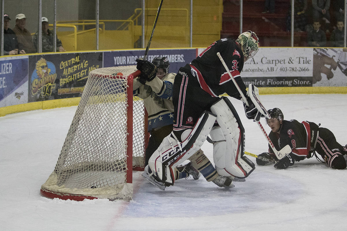 GENERALS WIN - Lacombe General Kyle Bailey crashed the net hard for the first goal of the game against the Rosetown Redwings. The Generals would go on to win XXX-YYY in their home opener. Todd Colin Vaughan/Red Deer Express