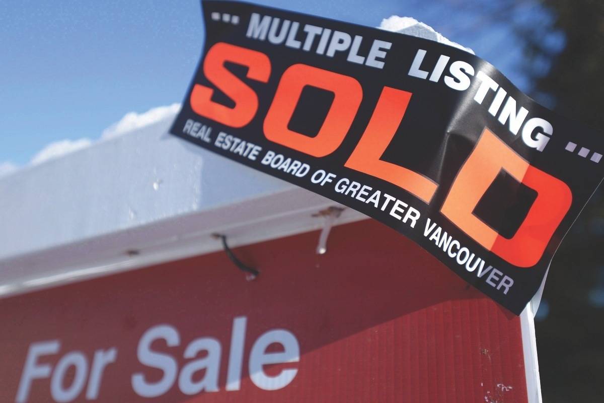 A real estate sold sign is shown outside a house in Vancouver, Tuesday, Jan.3, 2017. File photo. THE CANADIAN PRESS/Jonathan Hayward