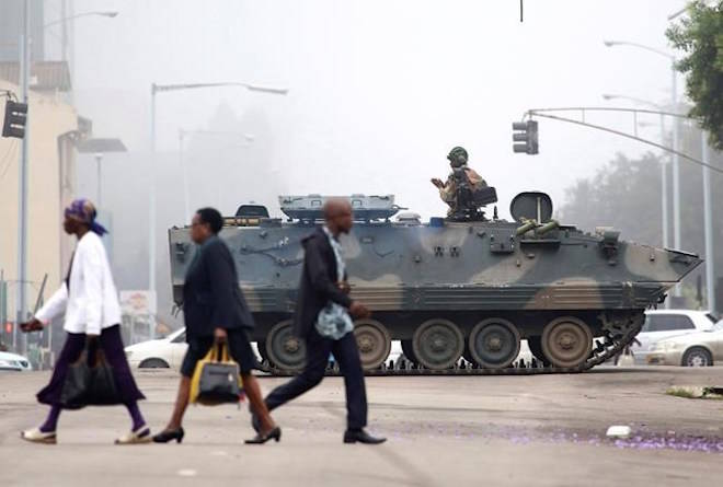 An armed soldier patrols a street in Harare, Zimbabwe, Wednesday, Nov. 15, 2017. THE CANADIAN PRESS/AP Photo