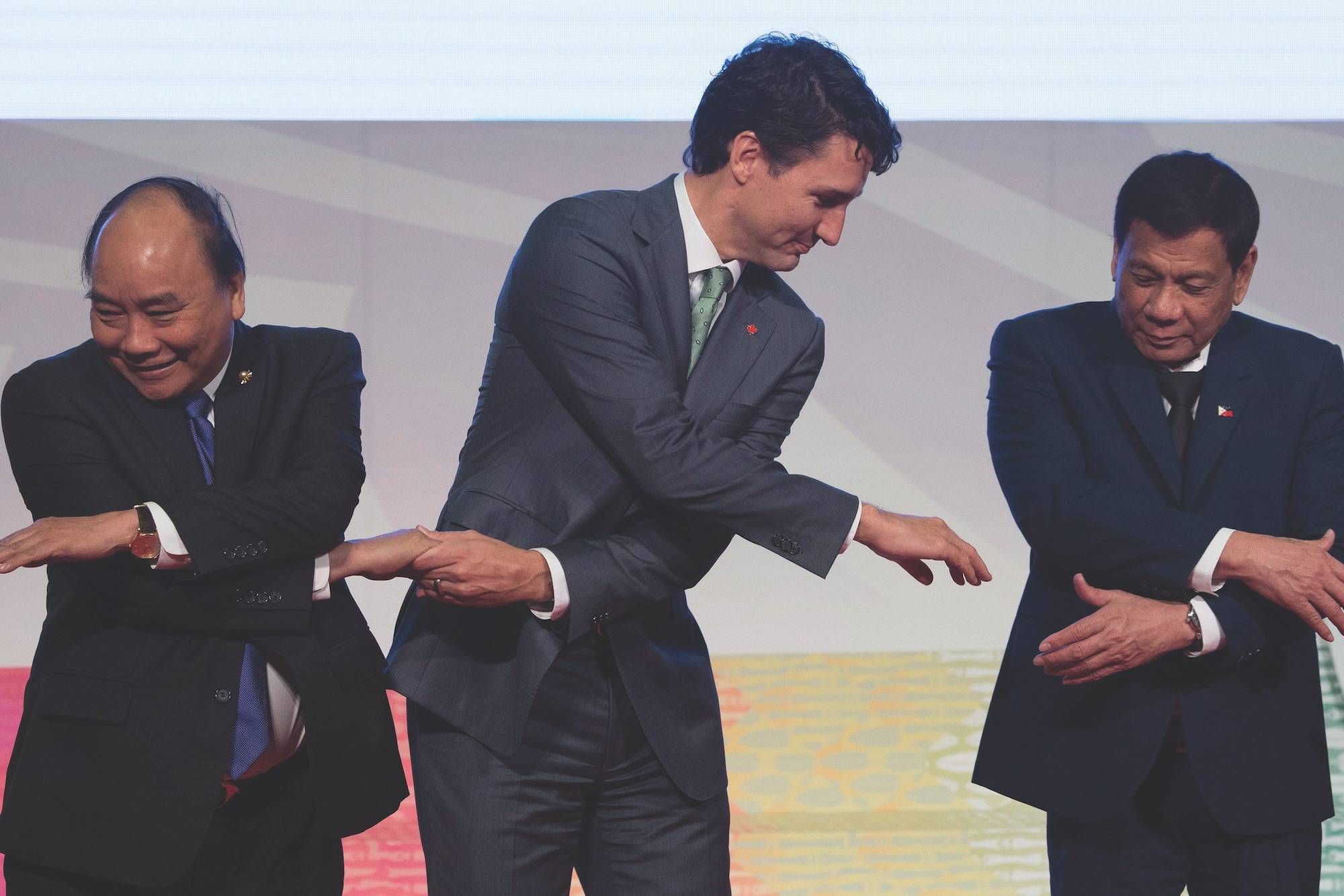 Canadian Prime Minister Justin Trudeau shakes hands with Vietnamese Prime Minister Nguyen Xuan Phuc and Philippine President Rodrigo Duterte during a photo for the ASEAN-Canada 40th Commemorative session in Manila, Philippines, Tuesday, November 14, 2017. THE CANADIAN PRESS/Adrian Wyld