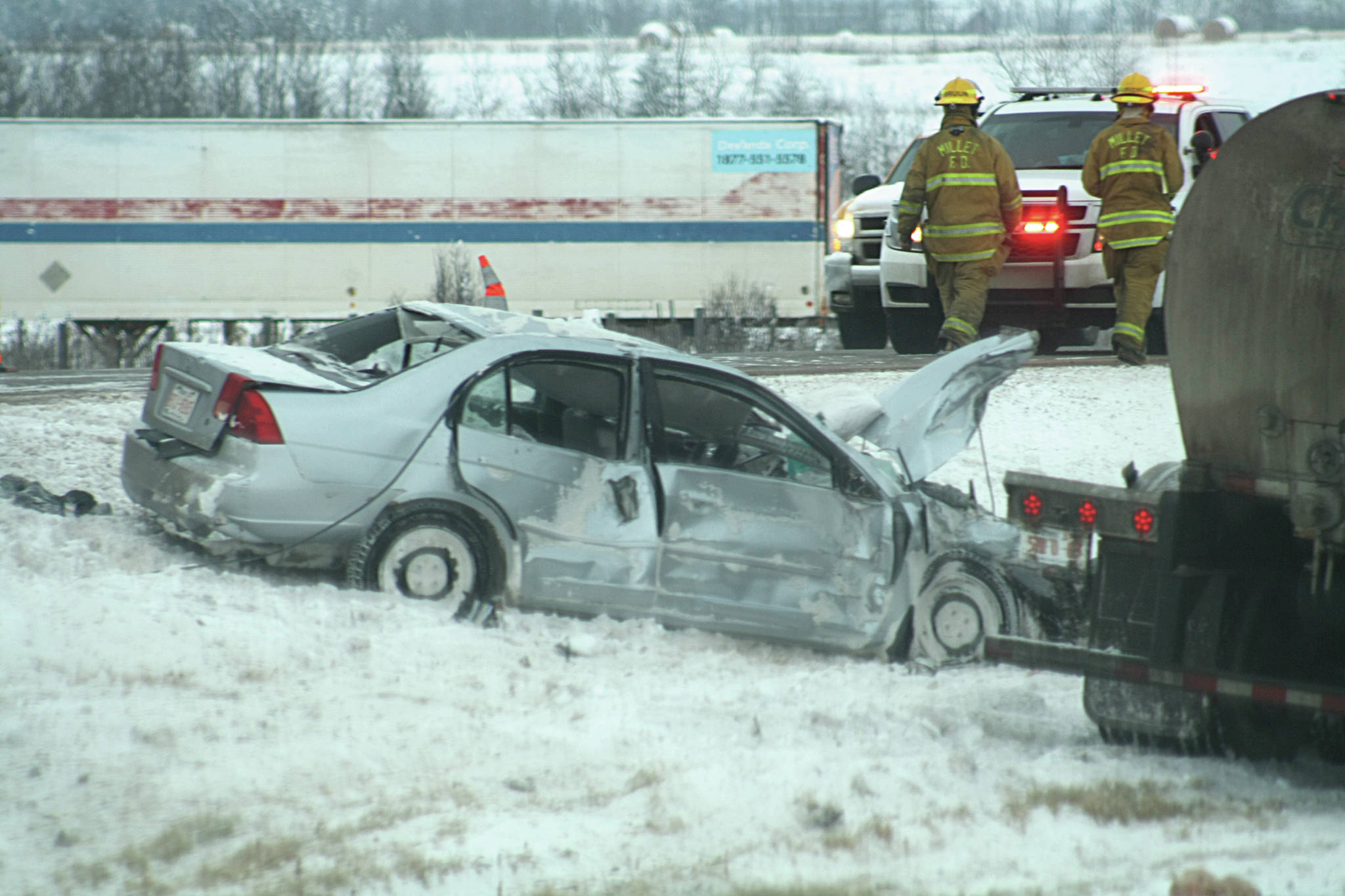 Semi collides with vehicle on Highway 2