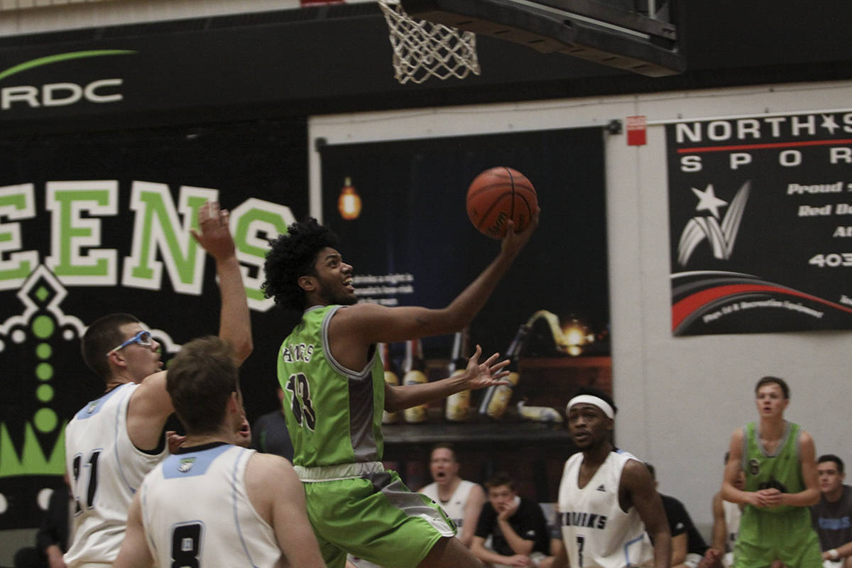 RAZZLE DAZZLE - Barzin Eskandarkhah drove this reverse layup into the Lethbridge hoop en route to a 97-90 RDC win. Todd Colin Vaughan/Red Deer Express