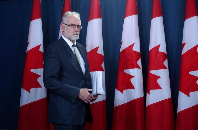 Auditor General Michael Ferguson arrives to hold a news conference at the National Press Theatre in Ottawa on Tuesday regarding his 2017 Fall Report. (Sean Kilpatrick/The Canadian Press)