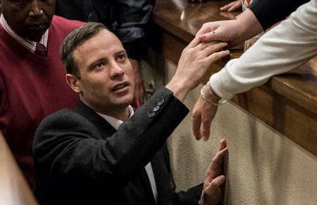 In this July 6, 2016, file photo, Oscar Pistorius leaves the High Court in Pretoria, South Africa, after a judge passed a new sentence of six years imprisonment after his conviction was changed to murder for shooting girlfriend Reeva Steenkamp in 2013. (Marco Longari, Pool Photo via AP)