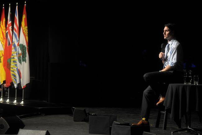 Prime Minister Justin Trudeau takes questions from the audience following his Symons Lecture speech at the Confederation Centre of the Arts in Charlottetown, P.E.I., on Thursday. (Nathan Rochford/The Canadian Press)