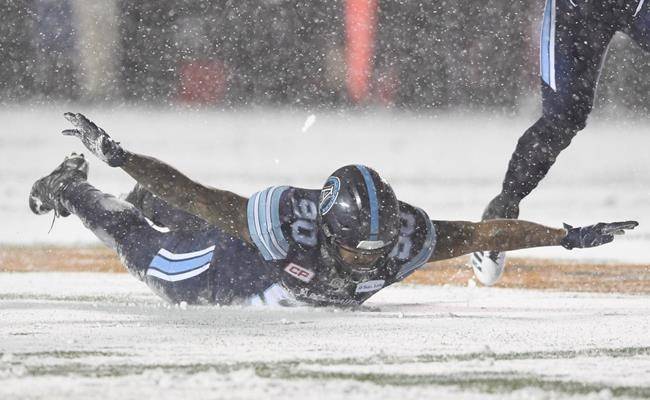 Toronto Argonauts defensive lineman Cleyon Laing (90) celebrates a quarterback sack against the Calgary Stampeders during first half CFL football action in the Grey Cup Sunday in Ottawa. (Sean Kilpatrick/The Canadian Press)