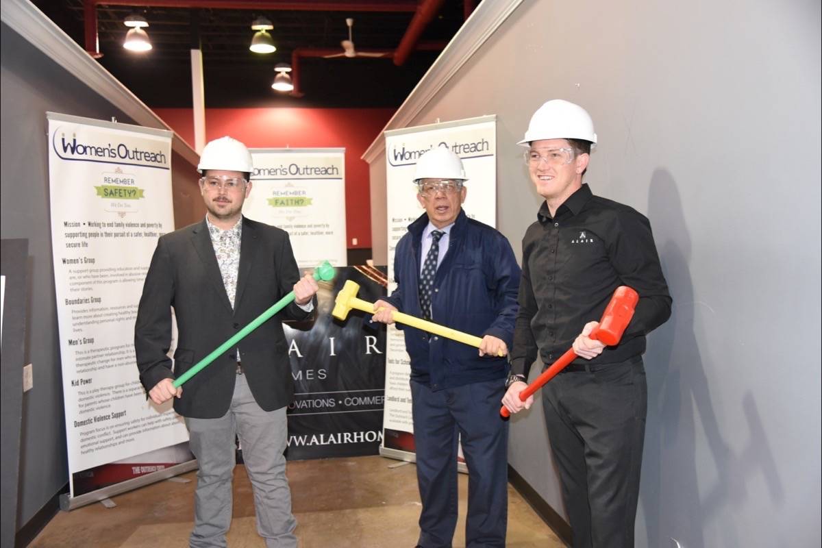 HAMMERING AWAY - Dustin Marsh of Alair Homes, Councillor Frank Wong and Jest Sidloski with Red Deer Outreach Centre began demolition to kick off the construction of The Outreach Centre’s new facility for youth and children, the Dragon Fly Centre. Michelle Falk/Red Deer Express