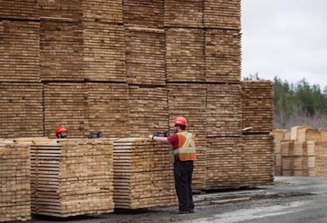 Employees work in the lumber yard at Ledwidge Lumber Co. in Halifax on May 10, 2017. THE CANADIAN PRESS/Darren Calabrese