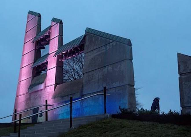 An unidentified woman walks past the bell tower before a ceremony to mark the 100th anniversary of the Halifax Explosion at Fort Needham Memorial Park in Halifax on Wednesday, Dec. 6, 2017. THE CANADIAN PRESS/Andrew Vaughan