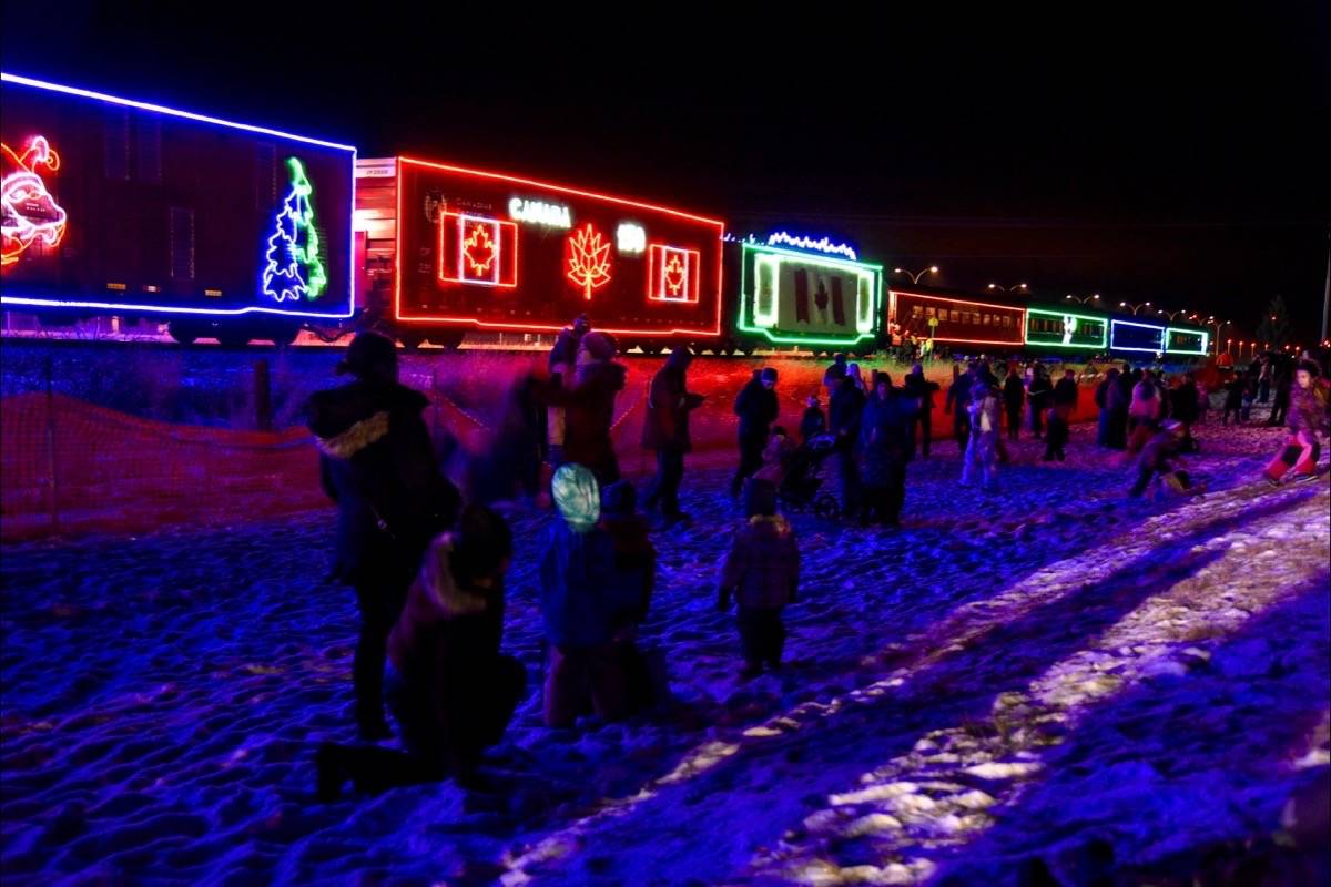 HOLIDAY TRAIN - Families watch Colin James and Emma Lee perform on the Canadian Pacific Holiday Train stop in Lacombe, Nov 6th. Michelle Falk/Red Deer Express