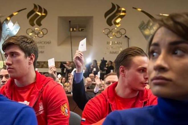 Russian athletes vote with their ballots during an Russian Olympic committee meeting in Moscow, Russia, Tuesday, Dec. 12, 2017. The Russian Olympic Committee formally gave its blessing Tuesday for the country’s athletes to compete under a neutral flag at the upcoming Pyeongchang Games. (AP Photo/Ivan Sekretarev)