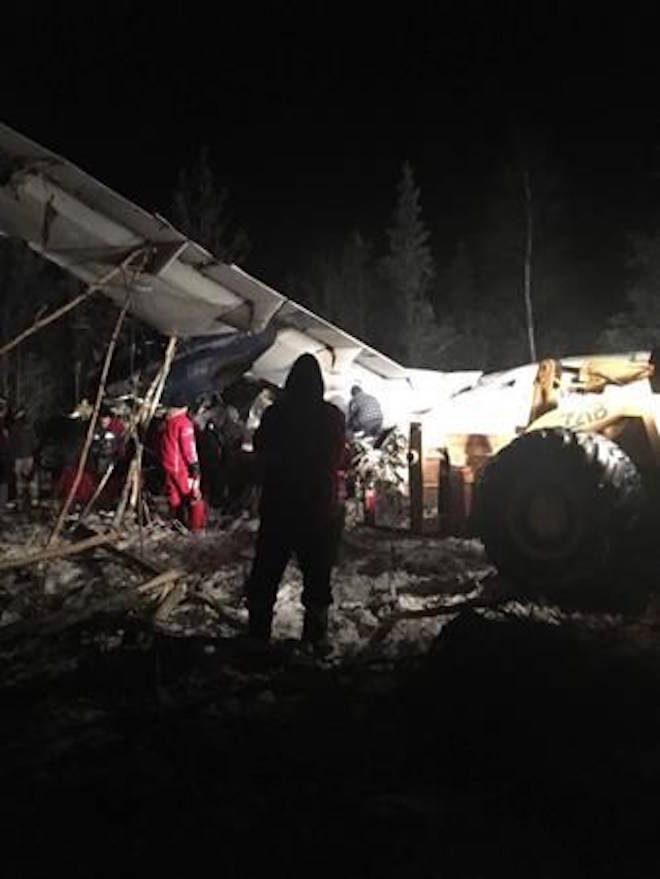 RCMP say a plane with 25 people on board has crashed in northern Saskatchewan shortly after taking off around 6:15 p.m. Wednesday at the Fond du Lac airport. First responders work the crash scene near the Fond du Lac airport in a Wednesday, December 13, 2017, image posted to social media. THE CANADIAN PRESS/HO-Facebook, Raymond Sanger.