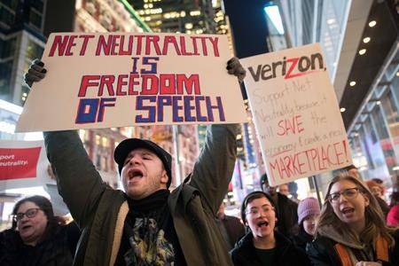 Demonstrators rally in support of net neutrality outside a Verizon store in New York on Dec 7. (Mary Altaffer/Associated Press)