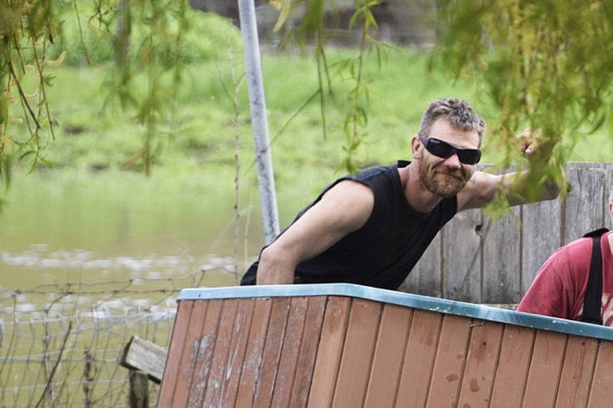 Curtis Sagmoen seen while helping neighbours deal with floods in Salmon Arm. (Black Press)