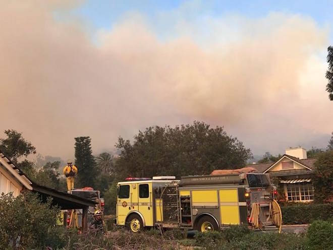 In this photo provided by the Santa Barbara County Fire Department,fire engines provide structure protection at the historic San Ysidro Ranch in Montecito, Calif., Saturday, Dec. 16, 2017. Mike Eliason/Santa Barbara County Fire Department via AP)