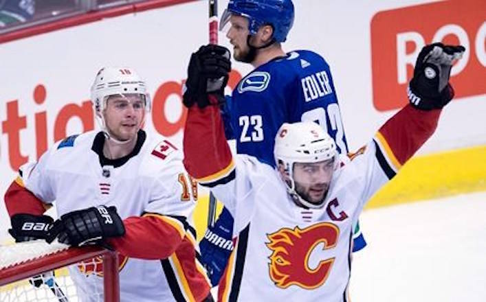Calgary Flames defenceman Mark Giordano (5) celebrates his goal against the Vancouver Canucks during the second period NHL action in Vancouver, Sunday, Dec. 17, 2017. THE CANADIAN PRESS/Jonathan Hayward