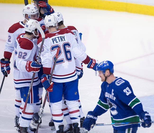 Canadiens down Canucks 7-5