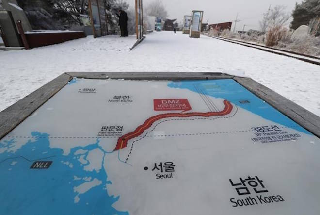 A visitor walks by a map of two Koreas at the Imjingak Pavilion in Paju, South Korea, Thursday, Dec. 21, 2017. South Korea’s military fired 20 rounds of warning shots Thursday as North Korean soldiers approached a borderline after their comrade defected to South Korea, officials said. (AP Photo/Lee Jin-man)